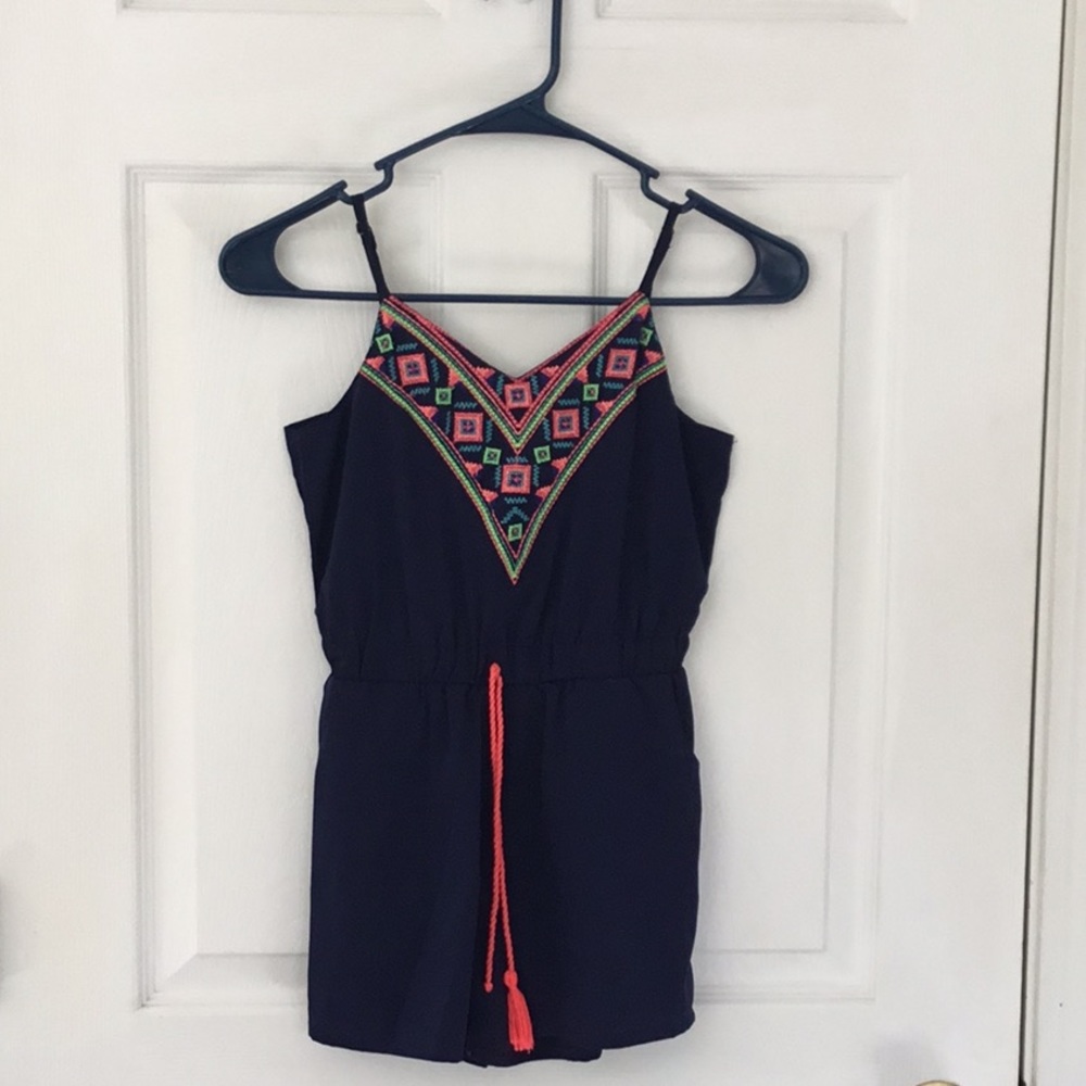 A blue romper with Aztec print!